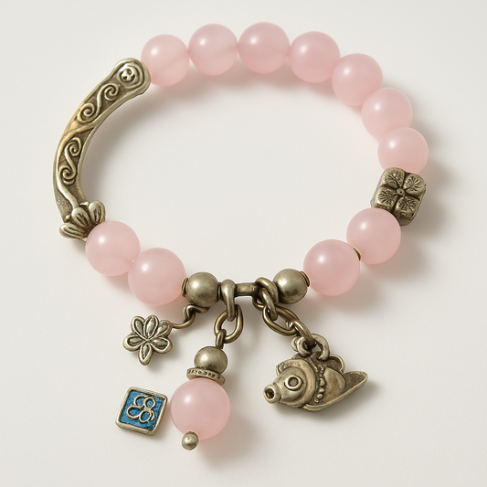 Whispers of Grace – Rose Quartz Charm Bracelet
